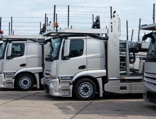 car transporters parked in row